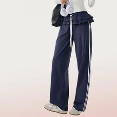 Straight vertical stripes cover the flesh and slim fitness wide-leg pants